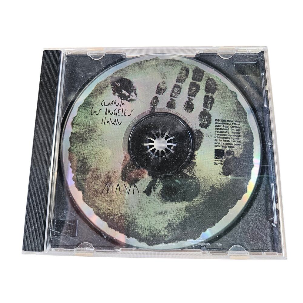 1995 CD Cuando los Ángeles Lloran by the Mexican pop-rock band Maná. NO BOOKLET